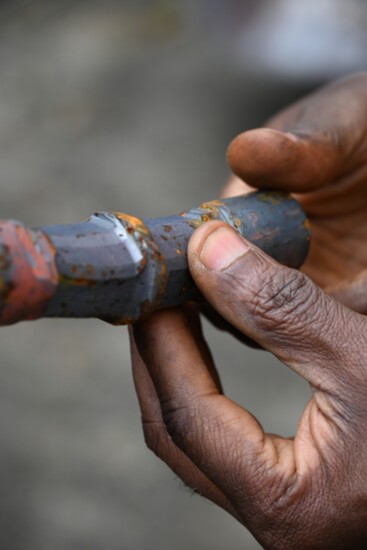 Olu Amoda holds raw materials