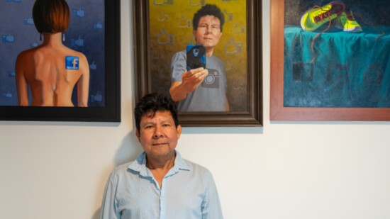 Saul Hernandez Quinarez with his work