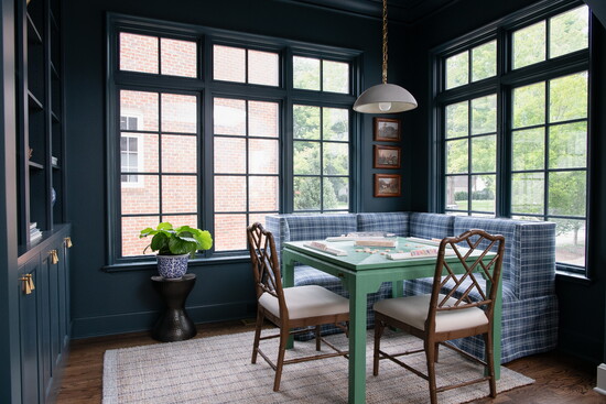 “The green game table adds a fun pop of color, and I love how it’s always mid-game, like someone just stepped away for a minute,” Grasso says.