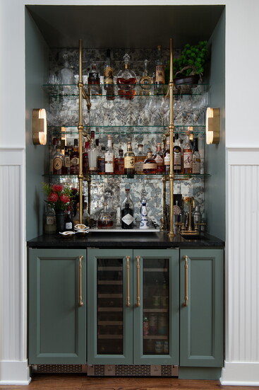 Grasso finished off the wet bar with two sculptural sconces from Visual Comfort by Kelly Wearstler