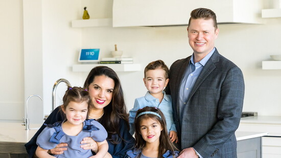Neil Kay and his wife, Anjou Ahlborn Kay, with their children.
