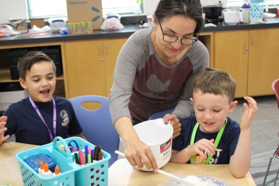 Students making something gooey with teacher Brenda Cabarga.