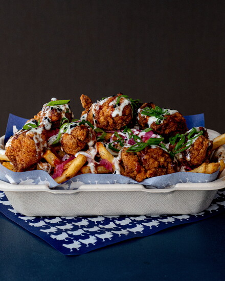 The Loaded CHX consists of russet fries topped with popcorn chicken and kimchi slaw