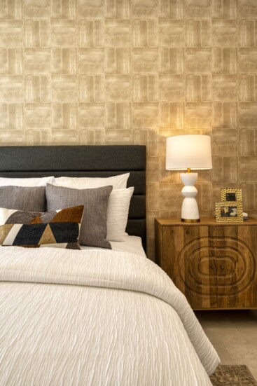This bedroom brings together color, texture, and an accent wall.