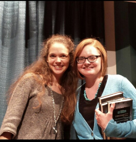 Hailey poses with The Inheritance Games author at a book-signing event.