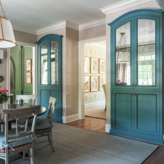 Storage cabinets in the breakfast room have custom mirrors created by local framer Chris Garner.