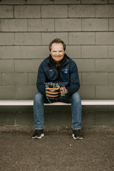 Coach Ed Servais sits in the dugout at Charles Schwab Field, reflecting on decades of impact as Creighton's winningest baseball coach
