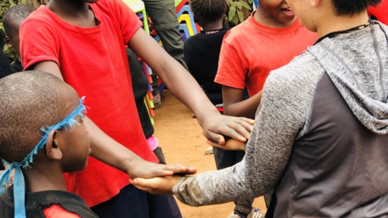 Teaching a game to Center of Hope students.