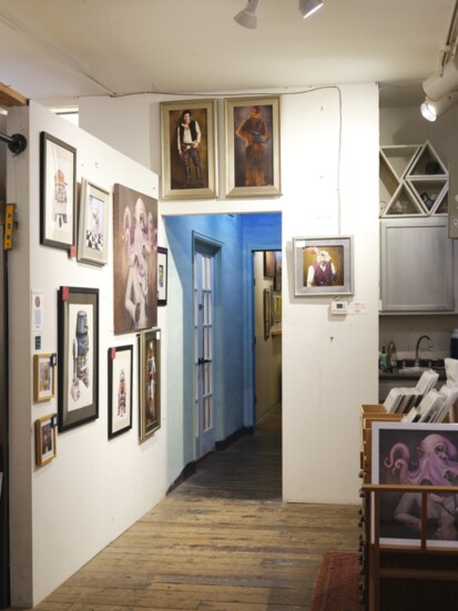 Hallway displaying art of the members of the private studios.