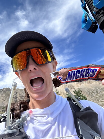 She packed real food alongside gels and electrolyte mix—PB&Js, Snickers bars, even potato chips. “You’re moving slow enough that it settles."