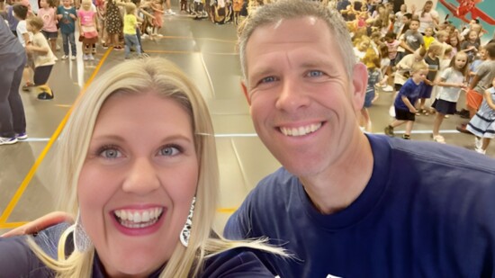 Wendi Bulkley of TDS and Principal Rod Broadhead kick off assembly at Desert Canyon Elementary