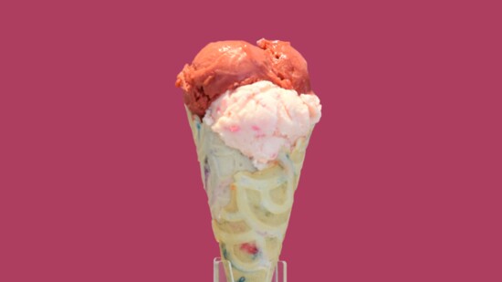 Bubble gum gelato topped with a scoop of raspberry sorbet.
