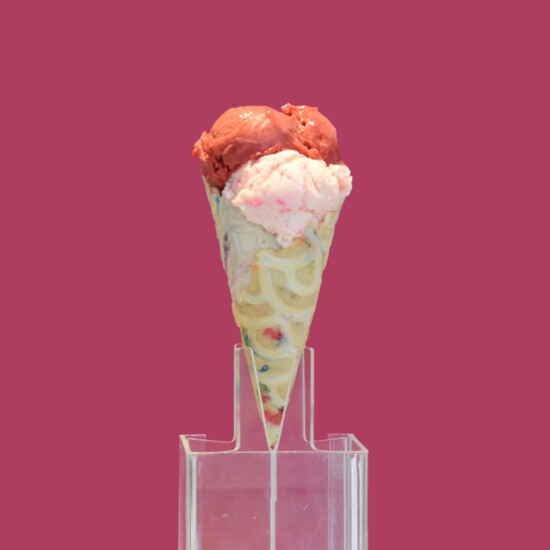 Bubble gum gelato topped with a scoop of raspberry sorbet.