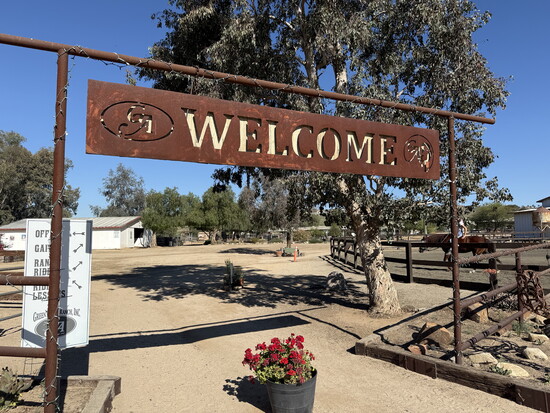 The welcome arch at Green Acres Interactive Therapy Ranch — where something meaningful begins.