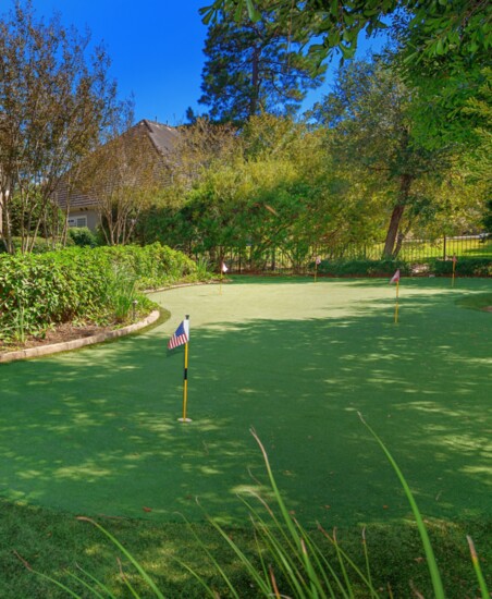 Backyard oasis with putting green