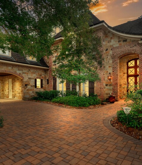 The circular drive leads to an oversized 4 car garage and porte-chochere.