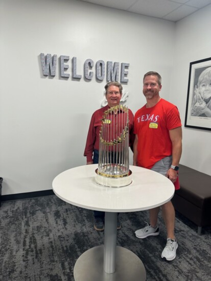 Mike and his son Ben Carter with the World Series Trophy, taken at the first World Series home game.