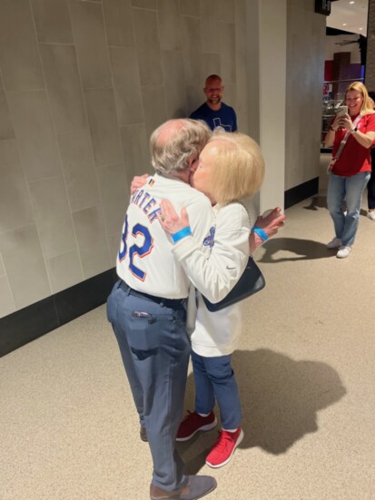 Mike gets a hug from wife Lynette. They've been married 57 years.