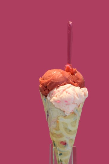 Bubblegum gelato topped with a scoop of raspberry sorbet