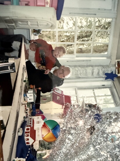 Grandpop after setting up the train set with Eddie