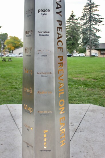 Close-up of Peace Pole inscriptions in the languages spoken in the community