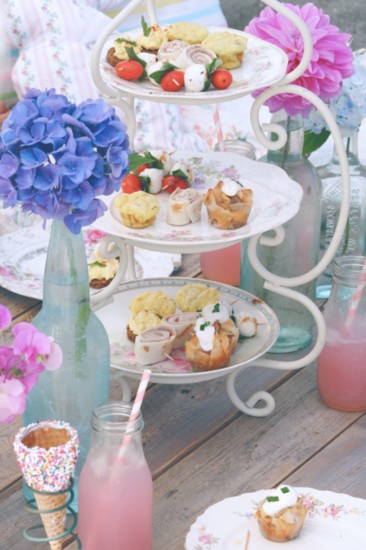 Vintage bone china in varying patterns create a casual yet sophisticated platform for kid-friendly hors d’oeuvres. Placed on a wooden palette board, this tier o