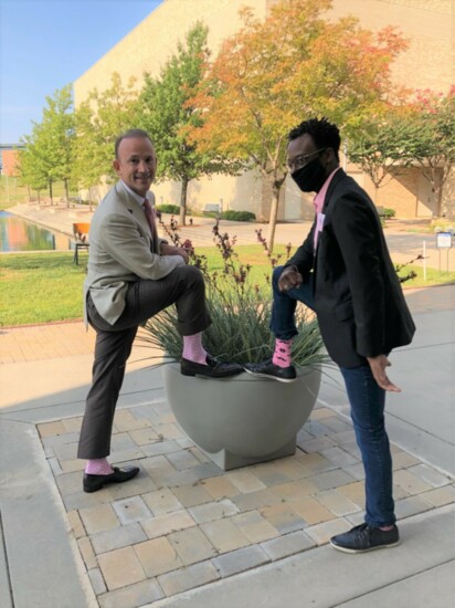 Co-Chair Armand McCoy and NRHS CEO Richie Splitt showing their pink socks 