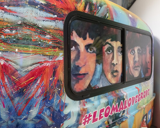 The Beatles peek through Lovegrove’s painted camper.