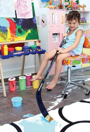 Creative strokes powered by a hockey stick brush. Photography by Portraits of Hope.