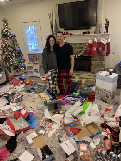 Houseparents Katie and Robert Sims smile before a successful Christmas morning mess!