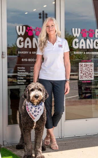 Woof Gang owner Joelle Millar poses with her friend and business inspiration, Kash.