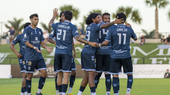 The team celebrating a goal together.