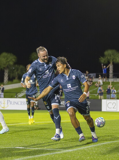 Julian Cisneros and Kevin O'Connor celebrating a game-winning goal