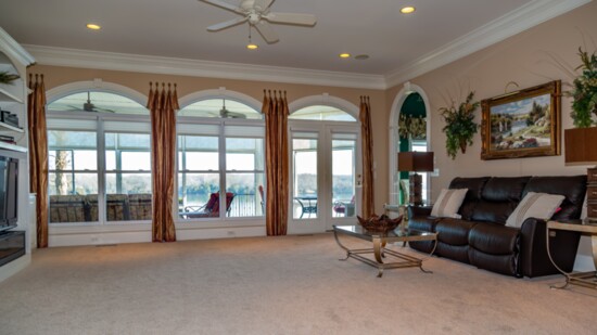 A spacious living space featuring spectacular views of the lake.