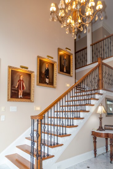A multi-tiered stairway leads to the  upstairs bedrooms and baths.