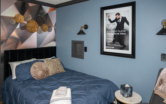 The cool modern vibe of Michael Bublé surrounds guests in this beautiful bedroom.