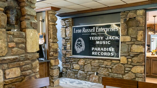 The main entertainment hall boasts an original sign commemorating the creation of Leon Russell's recording studio and home.