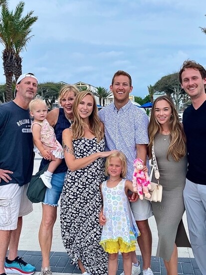 “This is my tribe. My wife, Leigh Ann, is standing next to me, then my daughter Madeline, son-in-law Zac, daughter-in-law Sloan, son Max and my granddaughters, 