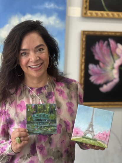 Deb Slack, of Art on Main, displays two of her paintings that capture the look and feel of Paris in the spring. Photo by Amy Adams