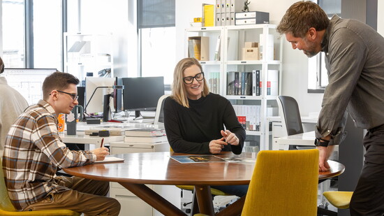 Architectural Designer Glen Lambert consults with Elisa Winter and Brandon Holben