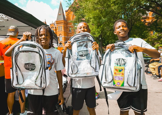 Kids with Burrow Bags at a Joe Burrow Foundation back-to-school event.