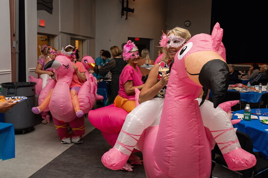 Sally is a member of the fun-loving gals group FOF (Flock of Flamingos). Here she is at a Coldwell Banker Cares event. 