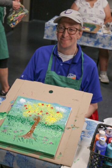 A Stepping Stones participant enjoys Art with Intention, a guided art class included in Adult Day Services.