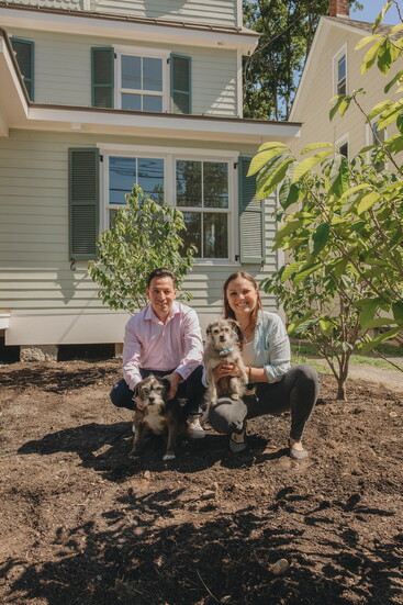 Masha and lead technician Stuart among the newly planted pawpaw trees outside Pawpaw Tree Veterinary Clinic in Branchville