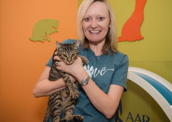 Cindy Boyd, volunteer with one of the rescued kittens.