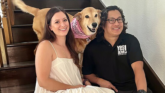 Dr. Arthur Abello and his partner with their dog, Daniella.