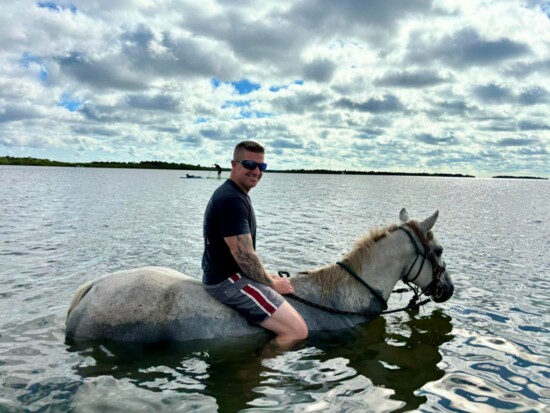 Nick Reagan looks like he's straight out of a post card horse back riding on a Reagan family vacation. Horses are a an important animal in therapy.