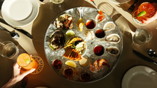 A medley of seafood options: white fish salad, oysters, shrimp cocktail. Image by Matt Conant.