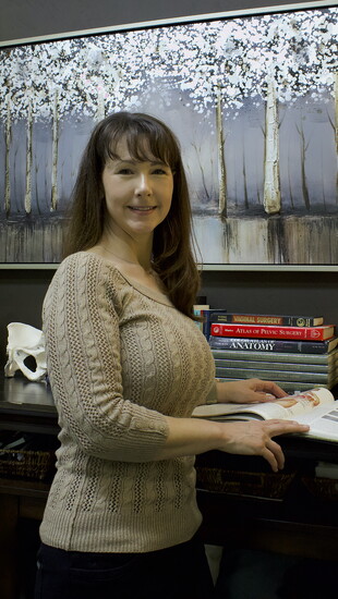 Evette D’Avy Reed, PT, founder of Purely Pelvic LLC, specializing in pelvic health for babies, children, and adults.