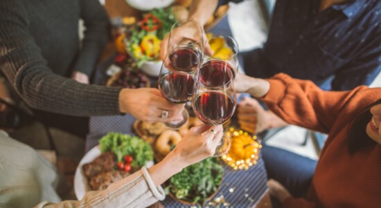 People toasting with wine.